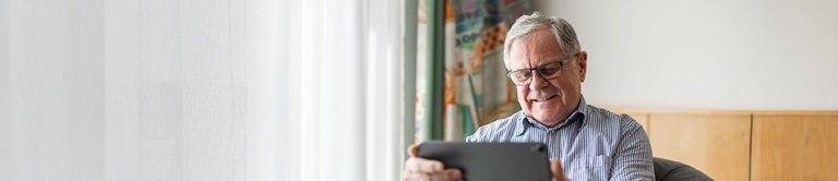 A man looking at tablet