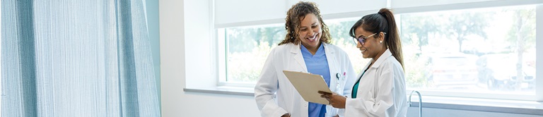 Providers looking at a clipboard 
