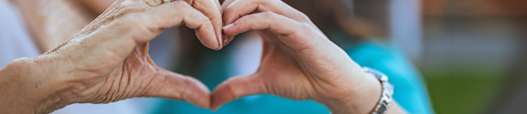 Two hands held together to form the shape of a heart