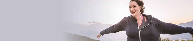 A woman with arms stretched outside
