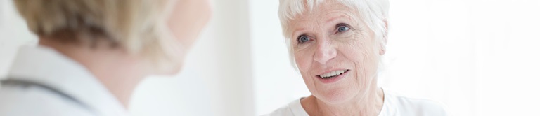 A provider looking at a woman