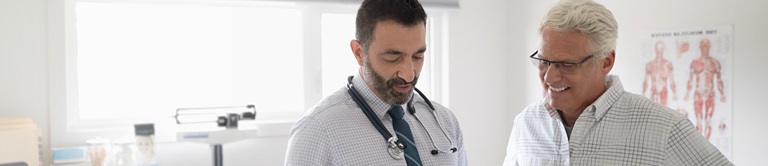 A doctor talking with a male patient