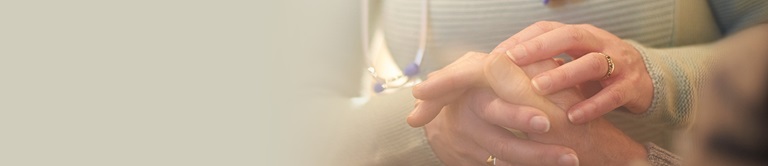 Holding a patients hand