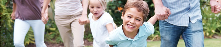 Family holding hands walking together