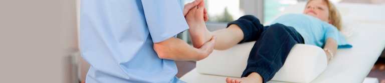 Stretching a boys foot and ankle