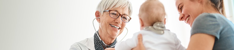 Doctor smiling at a baby