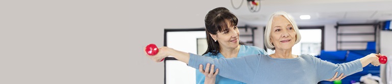 Older woman doing rehab lifting weights