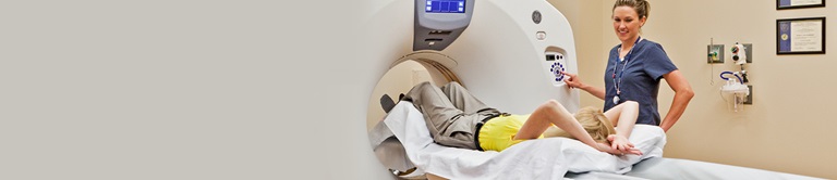 Nurse preparing a patient for a scan