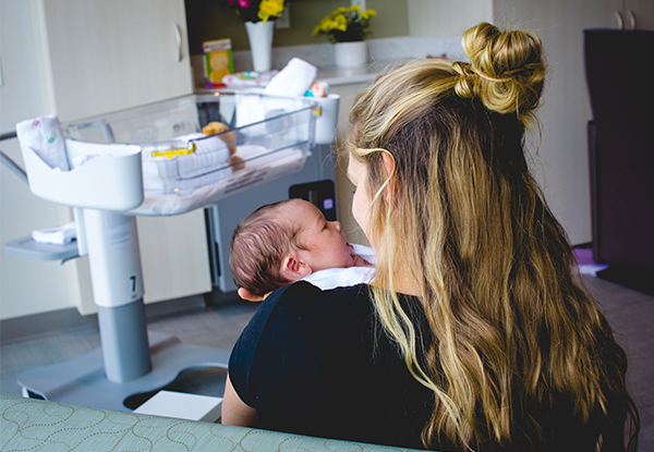 mother holding newborn