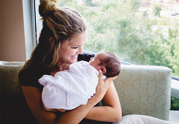 mother holding newborn