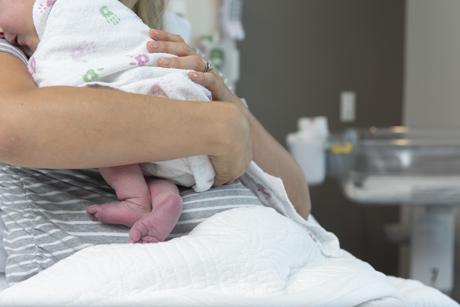 Person holding new-born