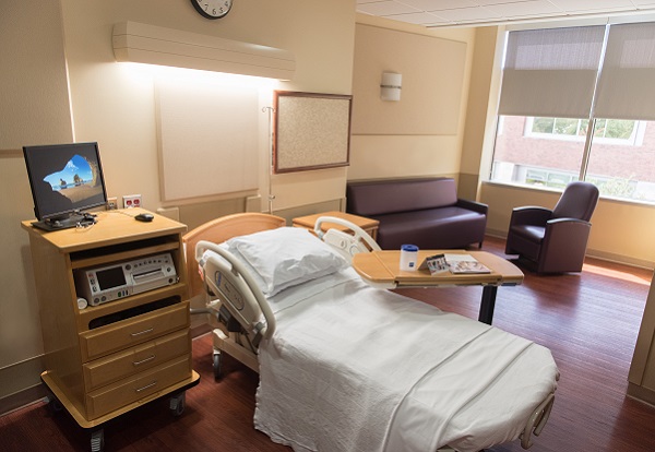 comfortable hospital room with sofa and chairs