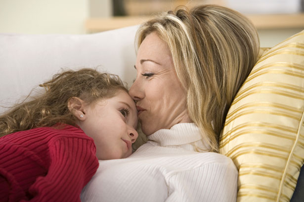 girl listening to woman's heart