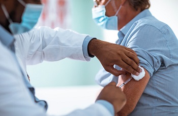 Image of individual getting a COVID-19 vaccine