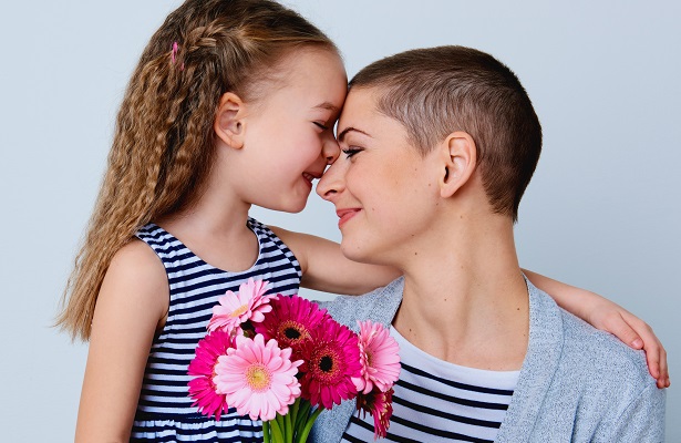 Image of mother cuddling with her daughter