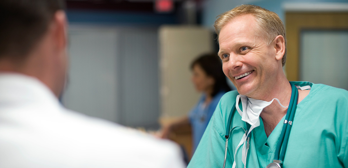 Smiling provider meeting with patient