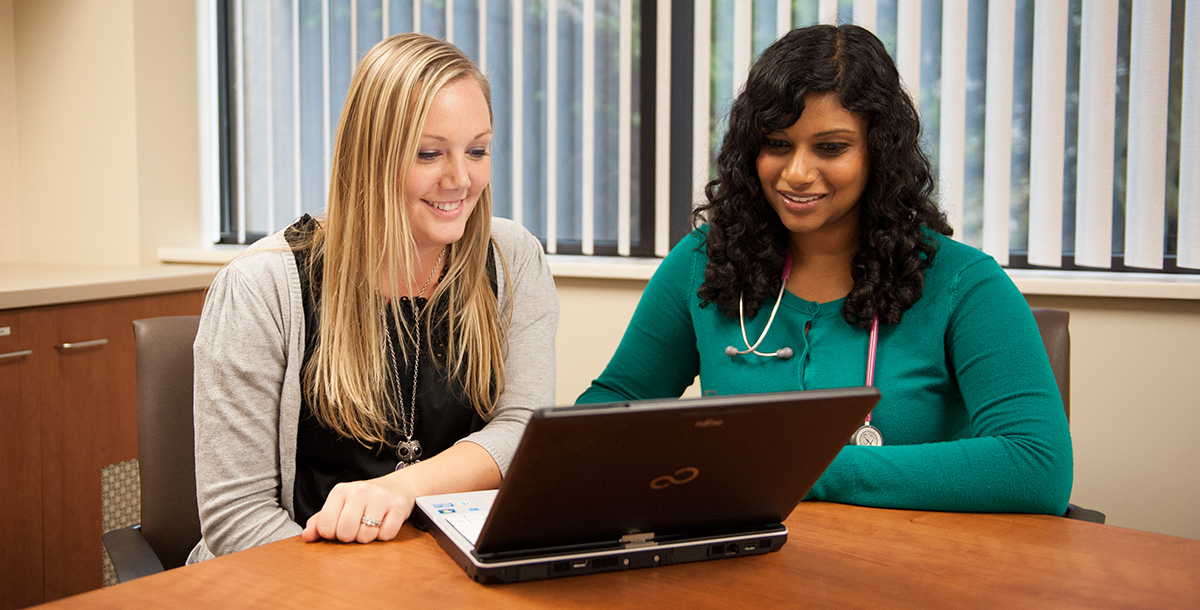 Image of individuals smiling during an education course