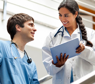 Young practitioners sharing information on a tablet