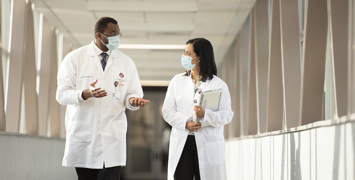 Resident and supervisor discuss case