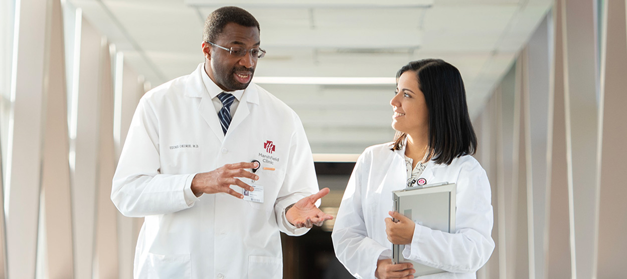 Resident and patient discuss case