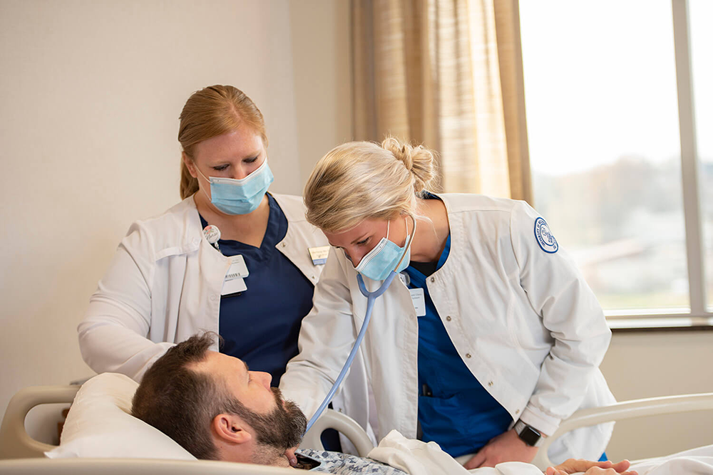 doctors checking a patient