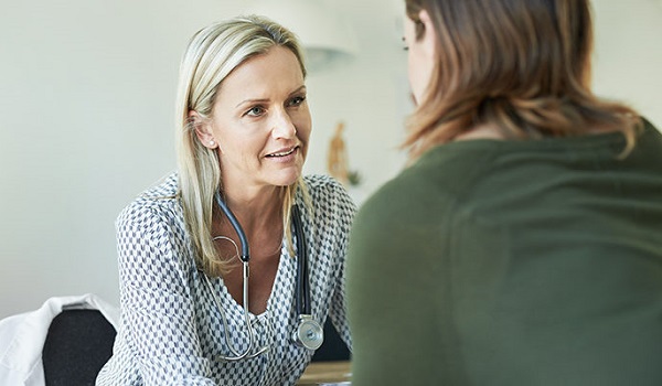 doctor examining patient