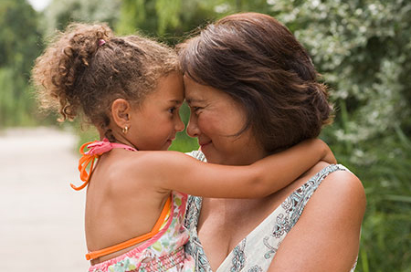 Woman holding young girl