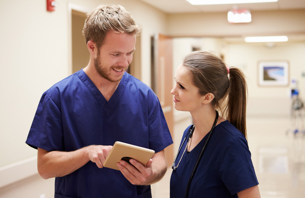 Nurses talking in a hospital hallway