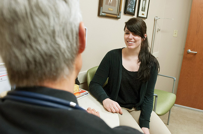 A Stevens Point Center physician talks with a patient