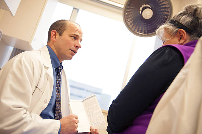 A Marshfield Clinic dermatologist counsels a patient in Marshfield