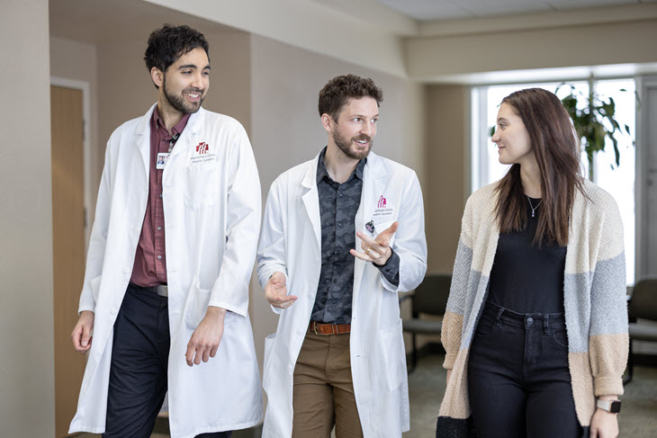 Residents talking in a hallway