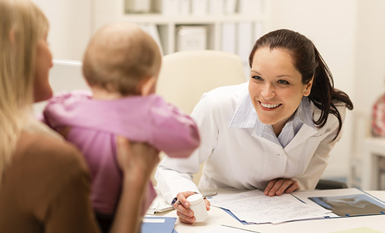 Pediatric fellow talking to a pediatric patient