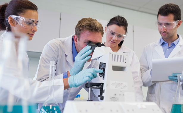 Students looking through microscope