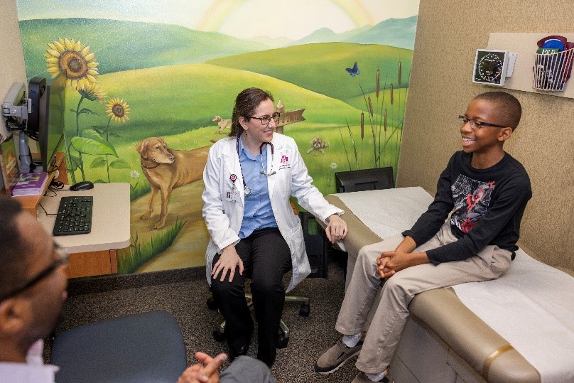 Resident meets with young patient