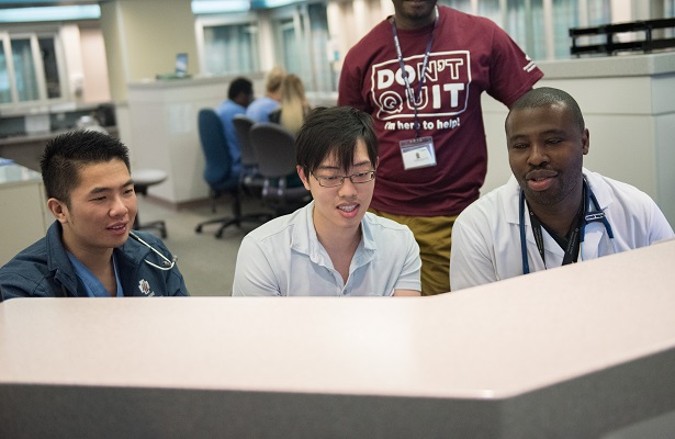 residents looking at computer screen