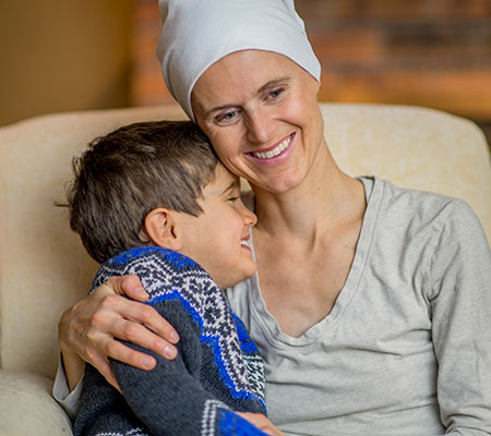 smiling cancer patient and child