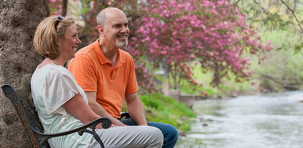 Couple sitting on park bench - Marshfield Clinic Health System Foundation sustain program