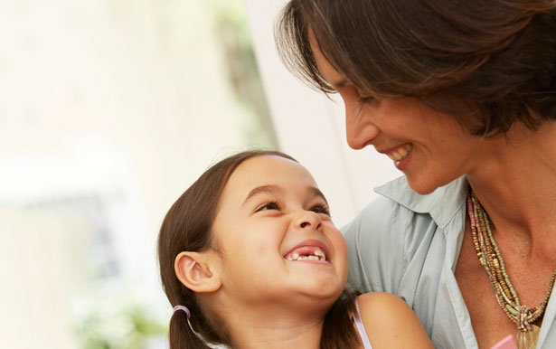 smiling woman and child