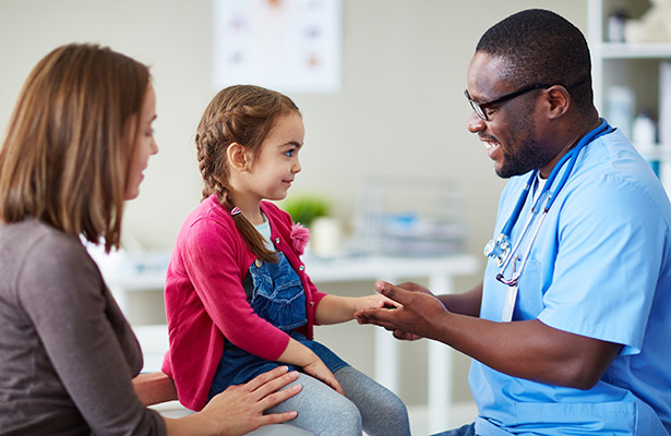 doctor and child in examining room