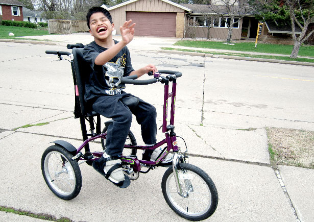 Child riding his custom bicycle in Marshfield