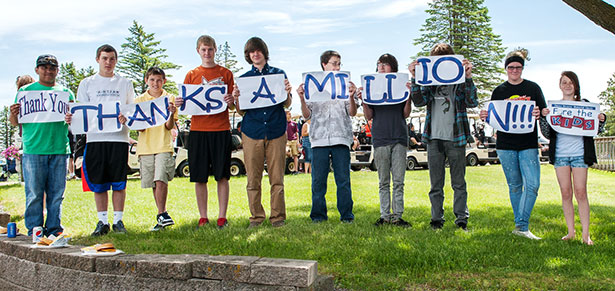 kids holding signs saying "thanks a million"