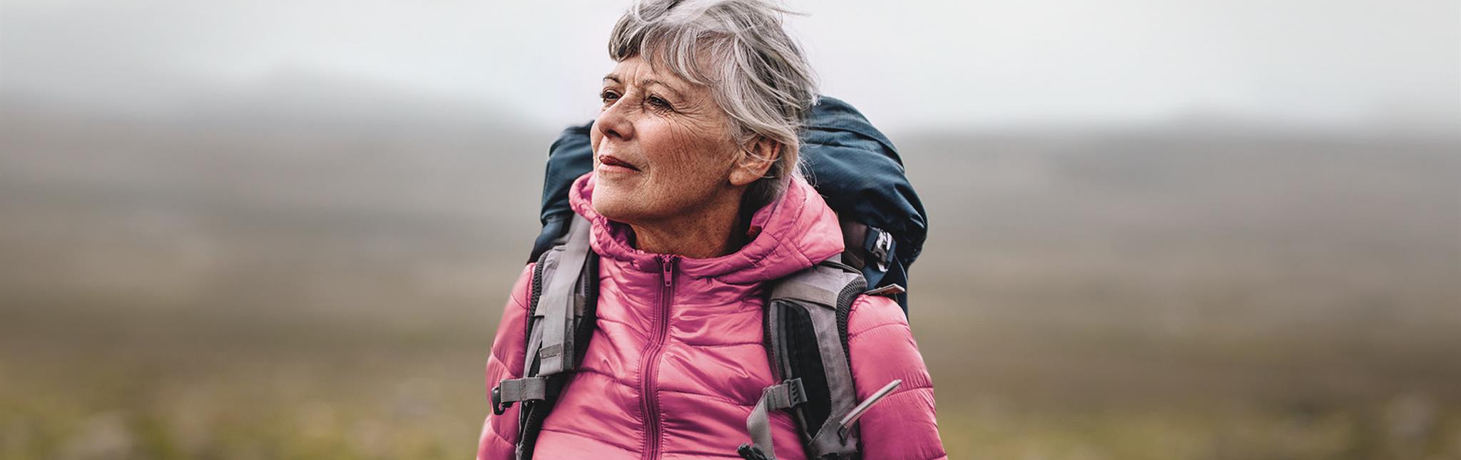 woman wearing coat and backpack