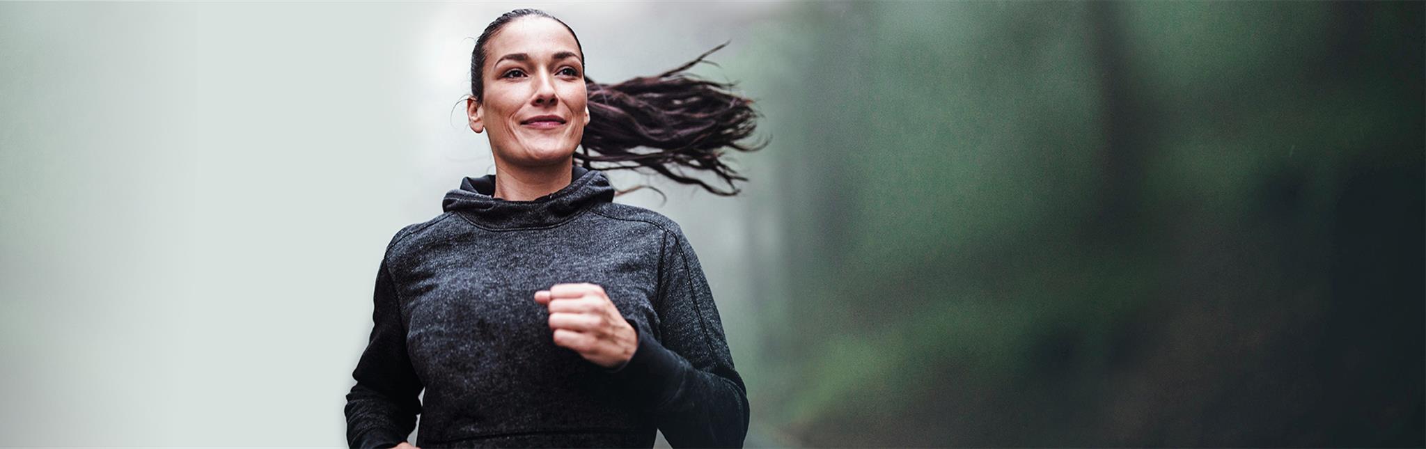smiling woman enjoying a run