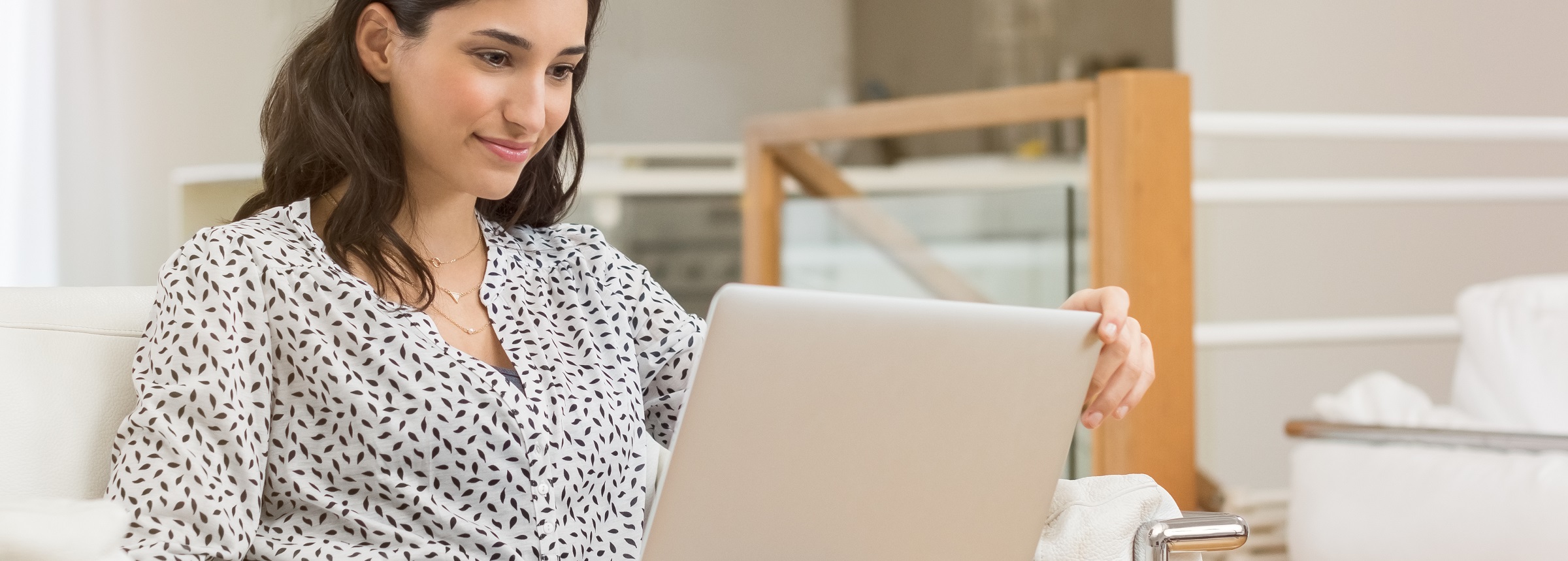 Woman looking at her cell laptop