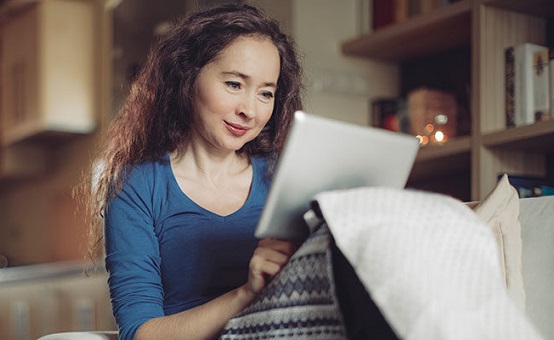 Image of woman messaging her provider on her tablet