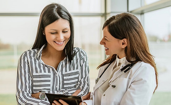 Image of patient looking at medical records with provider