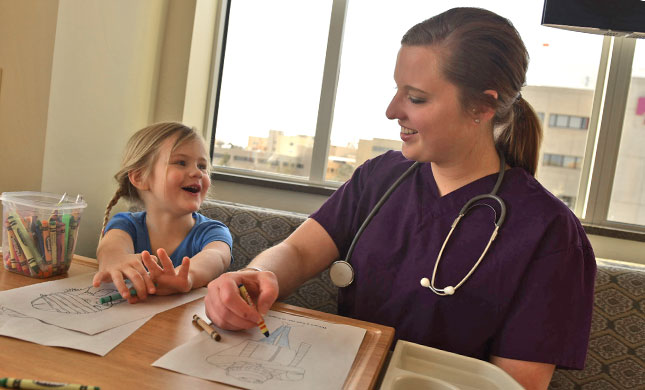 A nurse in a patient room