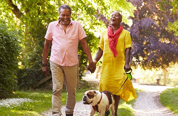 couple walking a dog