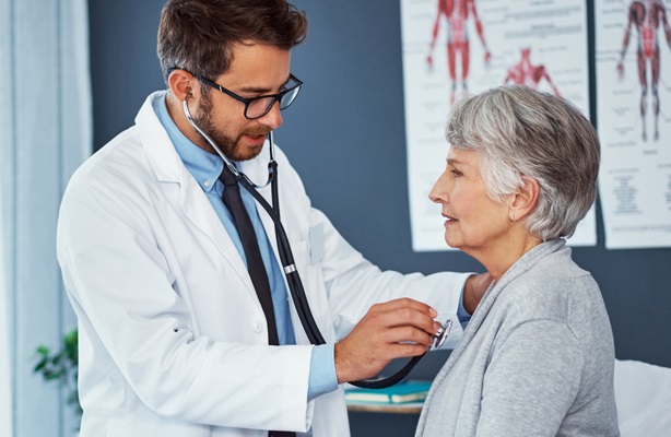 doctor examining patient