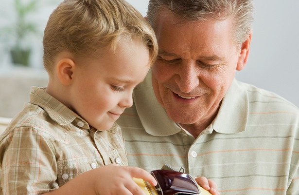 man showing something to a boy